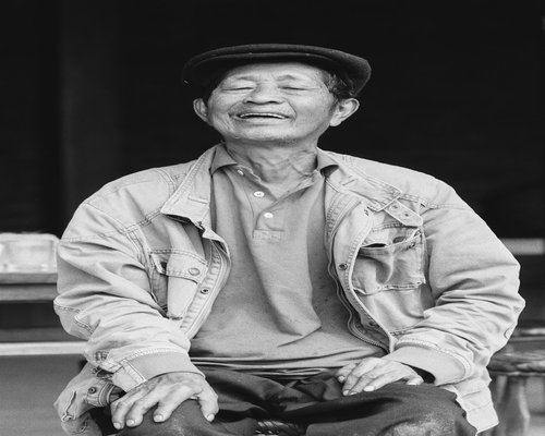 Portrait of smiling older asian man